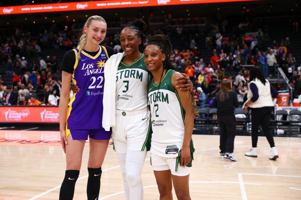 Former Sparks star Nneka Ogwumike poses for a photo with Sparks rookie Cameron Brink and new Storm teammate Kiana Williams.