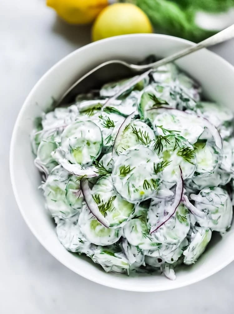 Creamy cucumber salad in a bowl