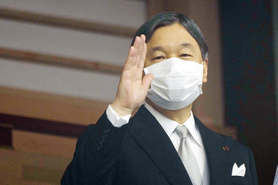 Japan's Emperor Naruhito waves well-wishers as he appears on the balcony of the Imperial Palace to mark the emperor's 63rd birthday in Tokyo Thursday, Feb. 23, 2023. (AP Photo/Eugene Hoshiko, Pool)