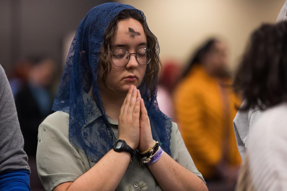 UTEP students and faculty pray as Bishop Mark J. Seitz celebrates Mass on Ash Wednesday at the university's Tomas Rivera Conference Center.
