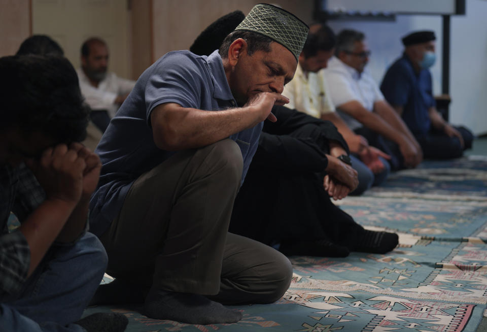 Members of the Zion Ahmadiyya Muslim community attend Friday prayer on Sept. 16, 2022, in Zion, Ill. The Ahmadi community will move from a suburban house, which was converted into a community center where the members pray, to a new multimillion dollar mosque in Zion. The Fath-e-Azeem mosque will be inaugurated on Saturday, Oct. 1, 2022. (AP Photo/Jessie Wardarski)