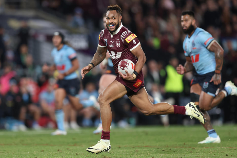 SYDNEY, AUSTRALIA - JUNE 05: Hamiso Tabuai-Fidow of the Maroons runs the ball to score a try during game one of the 2024 Men's State of Origin Series between New South Wales Blues and Queensland Maroons at Accor Stadium on June 05, 2024 in Sydney, Australia. (Photo by Matt King/Getty Images)