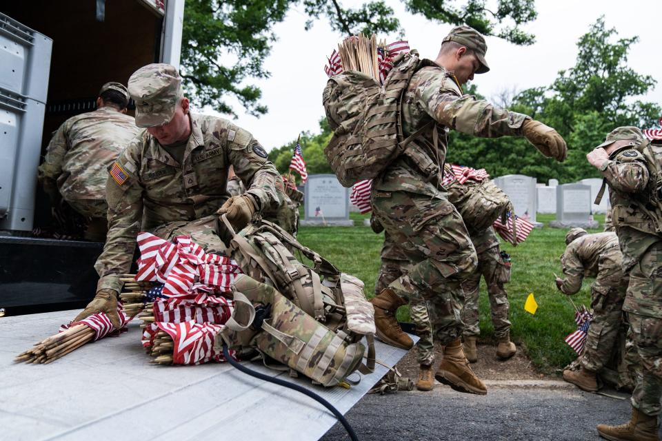 Members of the 3rd U.S. Infantry Regimentprepare to take part in a joint service “Flags-In” ceremony at Arlington National Cemetery on Thursday, May 25, 2023.