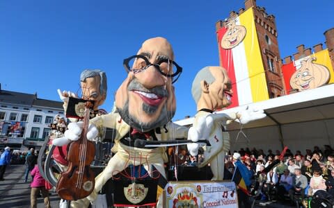 A carnival float carrying a giant caricature of Belgian Prime Minister Charles Michel  - Credit: AFP PHOTO / BELGA / NICOLAS MAETERLINCK&nbsp;