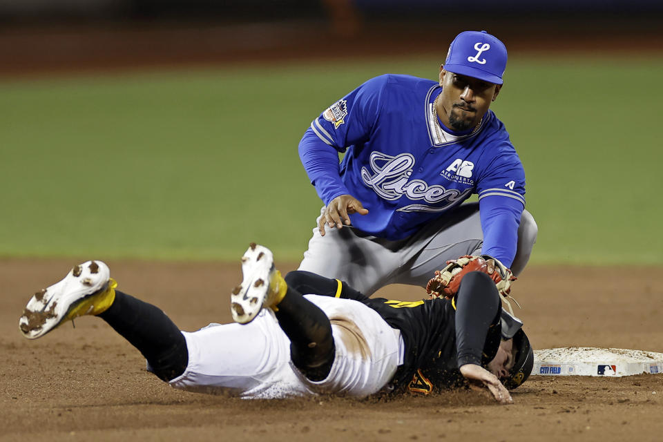 Los Tigres del Licey second baseman Robel Garcia tags out Águilas Cibaeñas' Cesar Prieto attempting to steal second base during the eighth inning of a Dominican Winter League baseball game Friday, Nov. 10, 2023, in New York. (AP Photo/Adam Hunger)