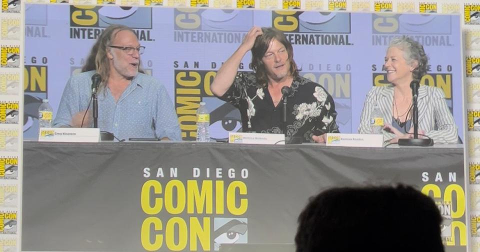 Norman Reedus considers how to respond to a fan question about Daryl during SDCC's "TWD" panel.