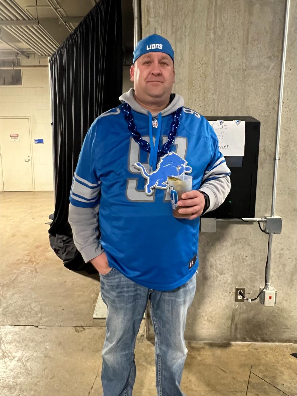 Derek Kirby, of Flint, poses for a photo at halftime of the Detroit Lions vs. Tampa Bay Buccaneers game on Sunday, Jan. 21, 2024. Kirby hoped for a more commanding second half performance from the Lions.