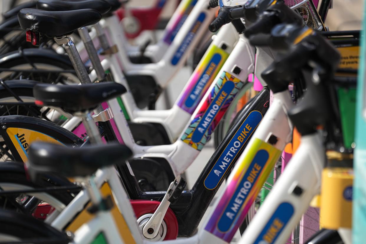 MetroBike electric bikes are parked at a dock on 4th Street on Monday Feb. 6, 2023 in Austin.