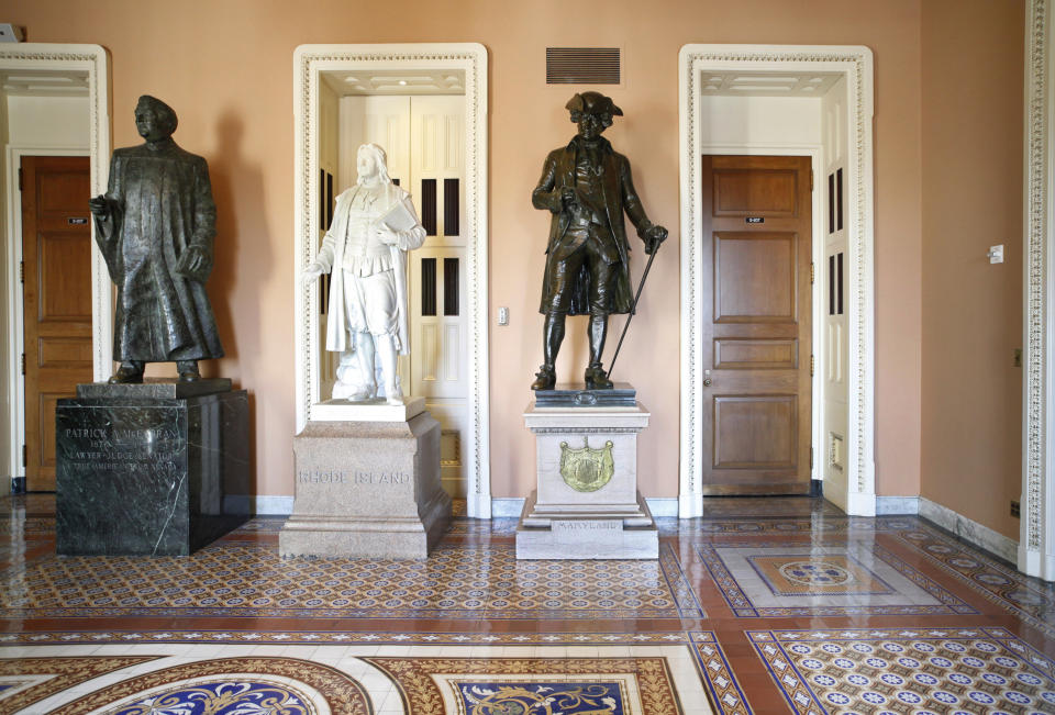 FILE - In this March 28, 2011, file photo, a larger-than-life bronze statue of Patrick A. McCarran of Nevada, left, stands near the entrance to the Senate floor on Capitol Hill in Washington. Democratic members of Nevada's congressional delegation are renewing a proposal to remove a statute of a former Nevada Sen. McCarran from the U.S. Capitol’s Statuary Hall, saying that he left a “legacy of racism, anti-Semitism, and xenophobia.” (AP Photo/J. Scott Applewhite, File)