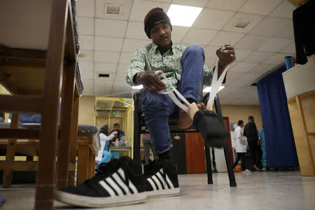 War-wounded Abdullah Ayed, 21 year-old man from Yemen, tries his 3D-printed prosthetic limb at the MSF-run hospital in Amman, Jordan February 27, 2019. Picture taken February 27, 2019. REUTERS/Muhammad Hamed