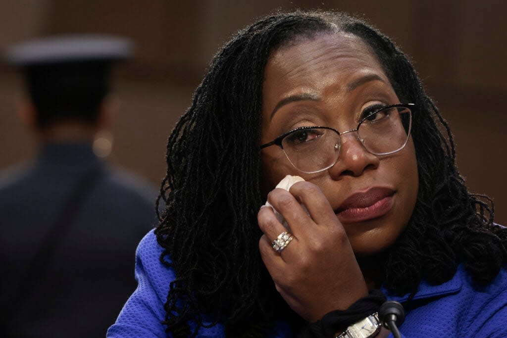 While listening to U.S. Sen. Cory Booker (D-NJ) speak, Supreme Court nominee Judge Ketanji Brown Jackson wipes away tears during her confirmation hearing before the Senate Judiciary Committee in the Hart Senate Office Building on Capitol Hill March 23, 2022 in Washington, DC. (Photo by Anna Moneymaker/Getty Images)