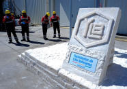 A sign made with salt blocks with the logo of state-owned Yacimientos de Litio Bolivianos (YLB), also known as Bolivian Lithium Deposits, is seen at the plant of Llipi in Uyuni, Bolivia, October 7, 2018. REUTERS/David Mercado