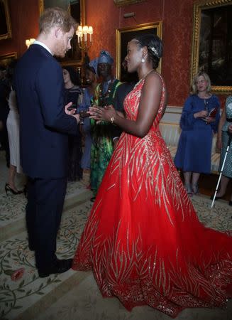 Britain's Prince Harry meets group of Queen's Young Leaders at a Buckingham Palace reception following the final Queen's Young Leaders Awards Ceremony, in London, June 26, 2018. Yui Mok/Pool via Reuters