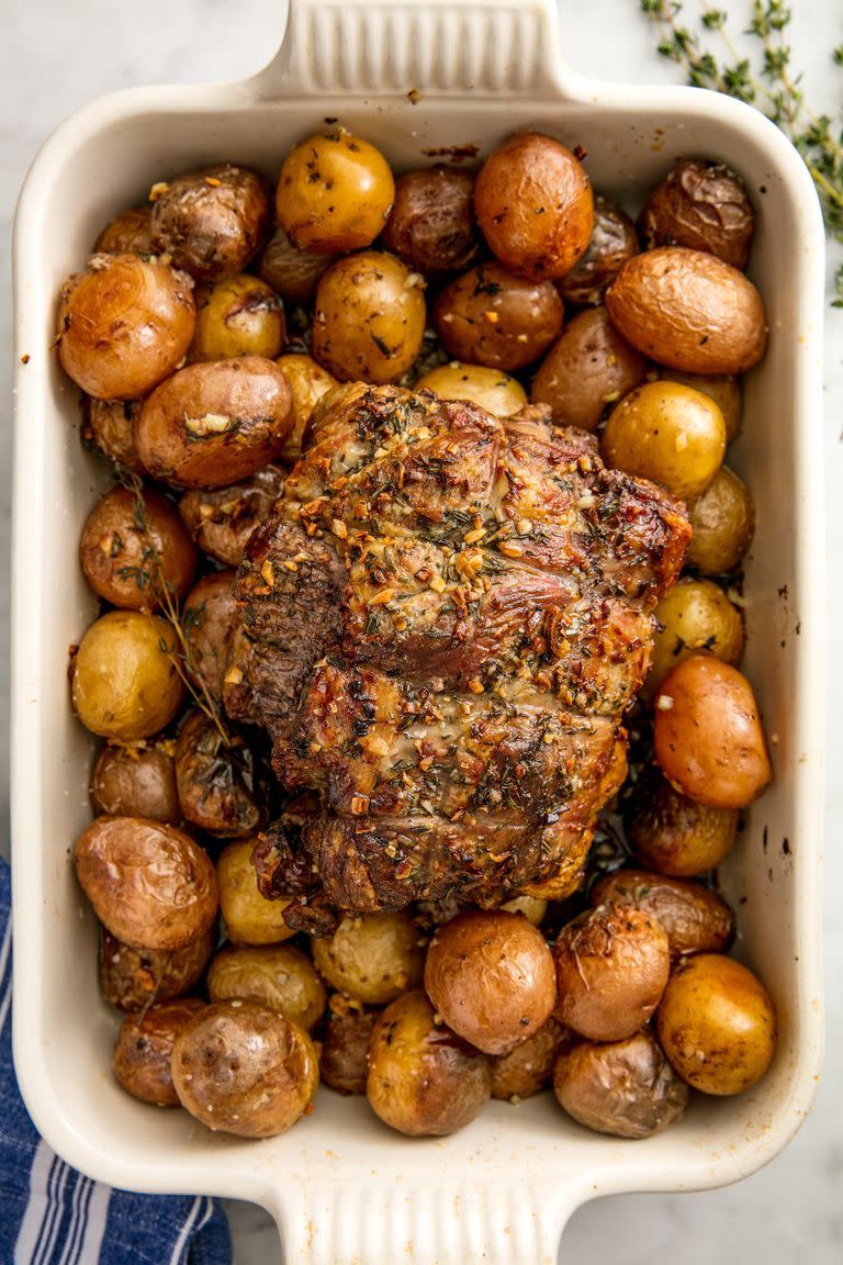 rack of roast lamb atop baby potatoes