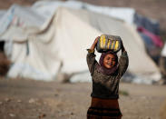 <p>A girl carries a can to fill it up with water at a camp for internally displaced people in Dharawan, near the capital Sanaa, Yemen, Feb. 28, 2017. (Khaled Abdullah/Reuters) </p>