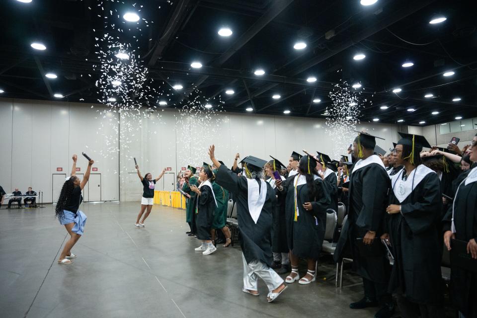 Western High School graduates celebrate after receiving their diplomas during their graduation ceremony on Friday, May 24, 2024.