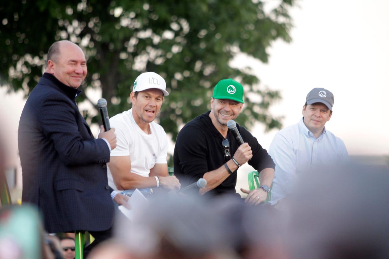 Mark, Donnie and Paul Wahlberg appeared in West Des Moines in 2018 to promote a now-shuttered location of their burger joint Wahlburgers.