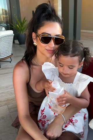 <p>Instagram/shaymitchell</p> Shay Mitchell poses with daughter Rome in a vacation photo