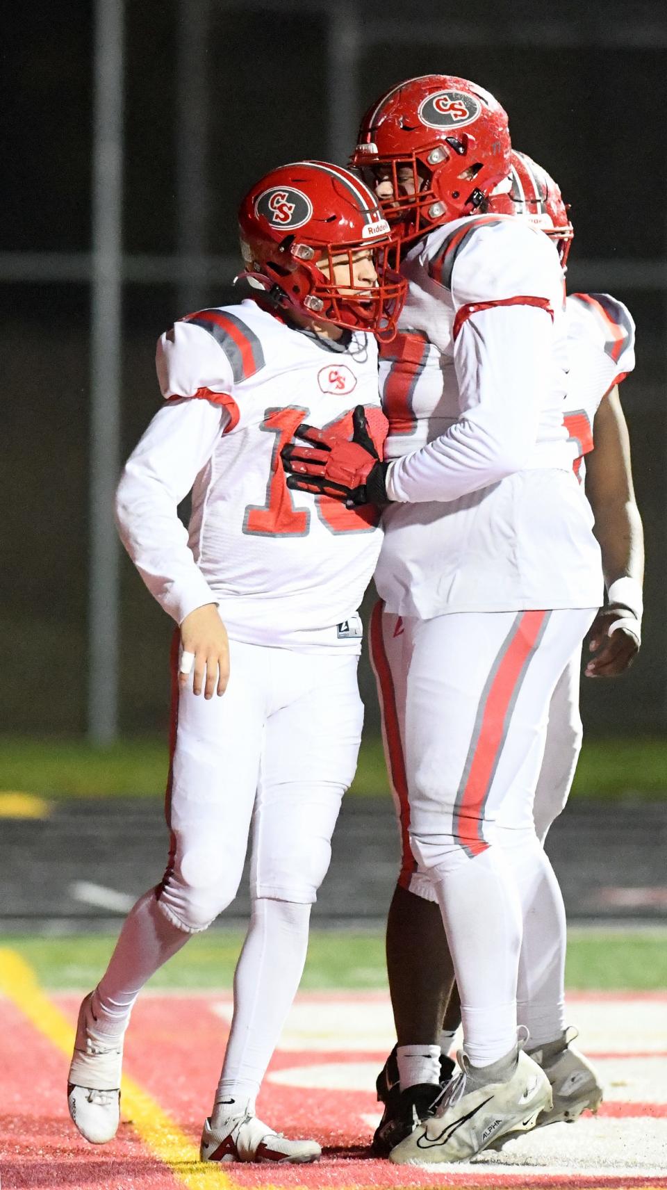 Canton South quarterback Poochie Snyder celebrates his touchdown with offensive lineman Max Cochran in the first quarter at Northwest. Friday, Oct. 20, 2023.