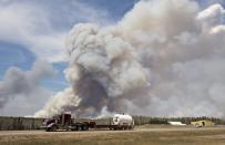 A wildfire rages through Fort McMurray, Alta, on Wednesday May 4, 2016. THE CANADIAN PRESS/Jason Franson