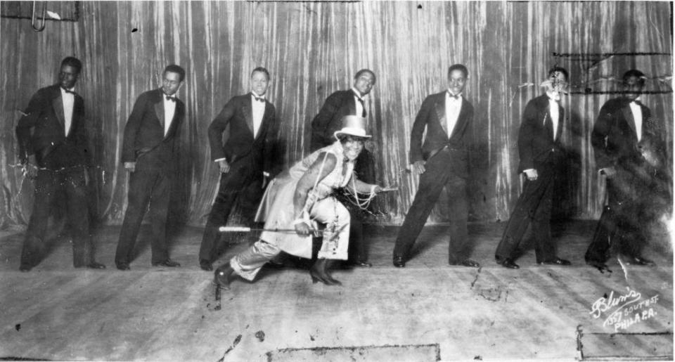 Bessie Smith dancing in front of a line of backup singers