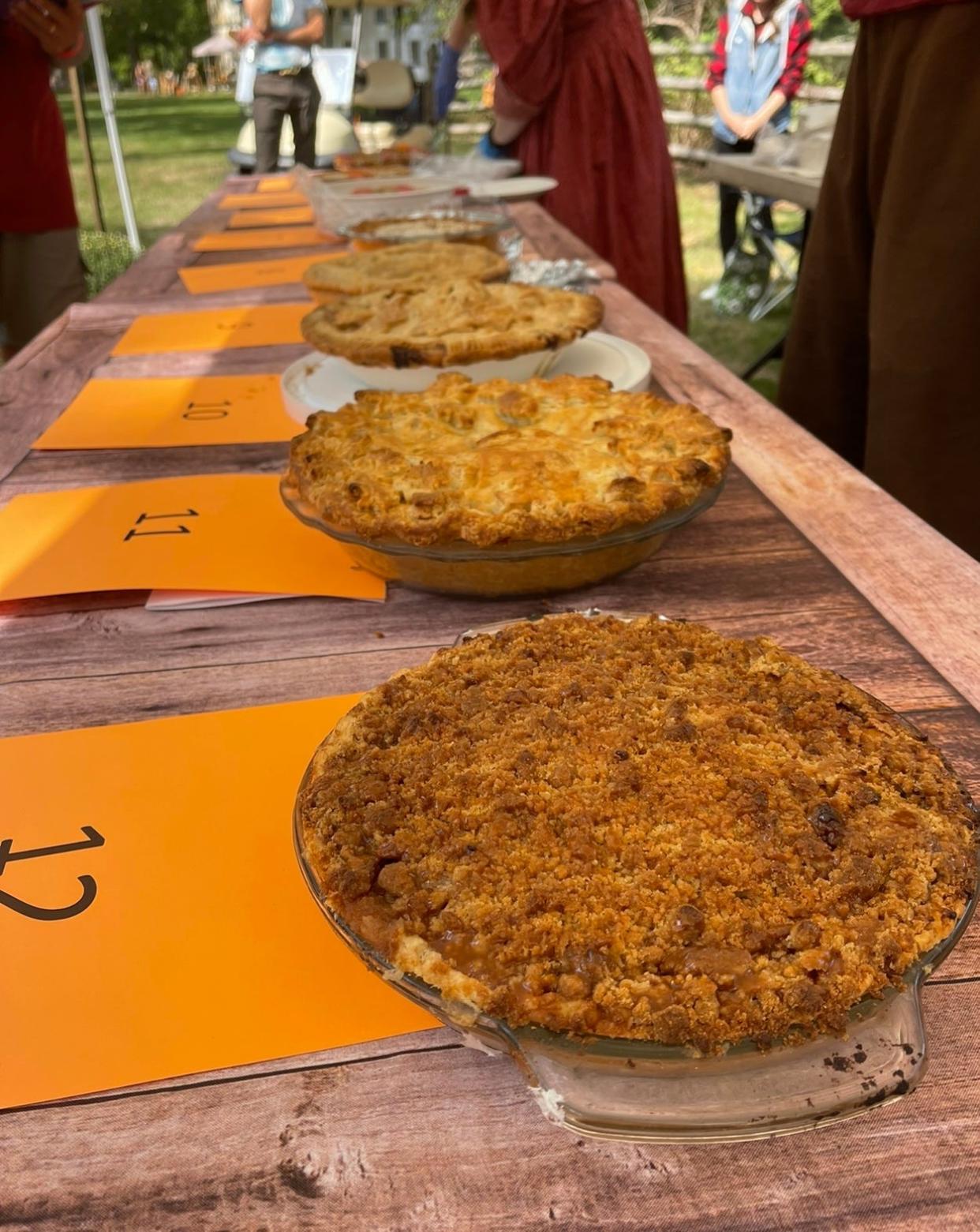 Contestant pies in Historic Allaire Village, New Jersey's annual apple pie contest, which is part of the Fall Apple Festival. Pie #12, seen in front, won the contest.