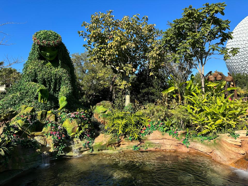 shot of moana journey of water attraction with the ecpot ball in the background