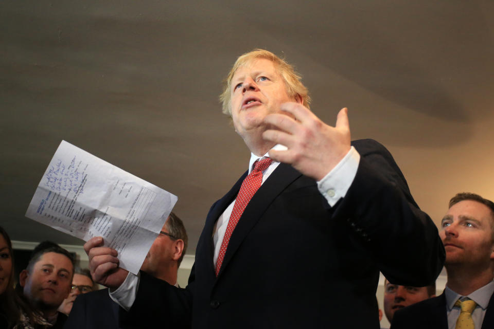 Prime Minister Boris Johnson speaks to supporters during a visit to see newly elected Conservative party MP for Sedgefield, Paul Howell during a visit to Sedgefield Cricket Club in County Durham.