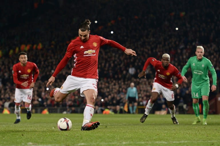 Manchester United's Swedish striker Zlatan Ibrahimovic shoots from the penalty spot to score his team's third goal during the UEFA Europa League Round of 32 first-leg football match against Saint-Etienne February 16, 2017