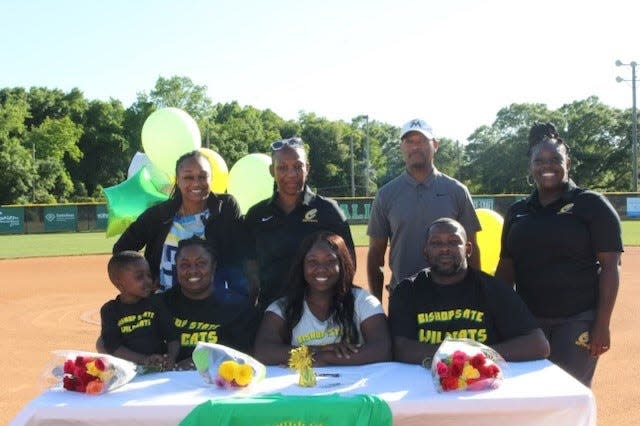 Pensacola Catholic softball standout Titera Dukes (bottom row, middle) signed with Bishop State Community College to play college softball.