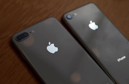 Apple's new iPhone 8 (R) and 8 Plus are seen after they go on sale at the Apple Store in Tokyo's Omotesando shopping district, Japan, September 22, 2017. REUTERS/Issei Kato