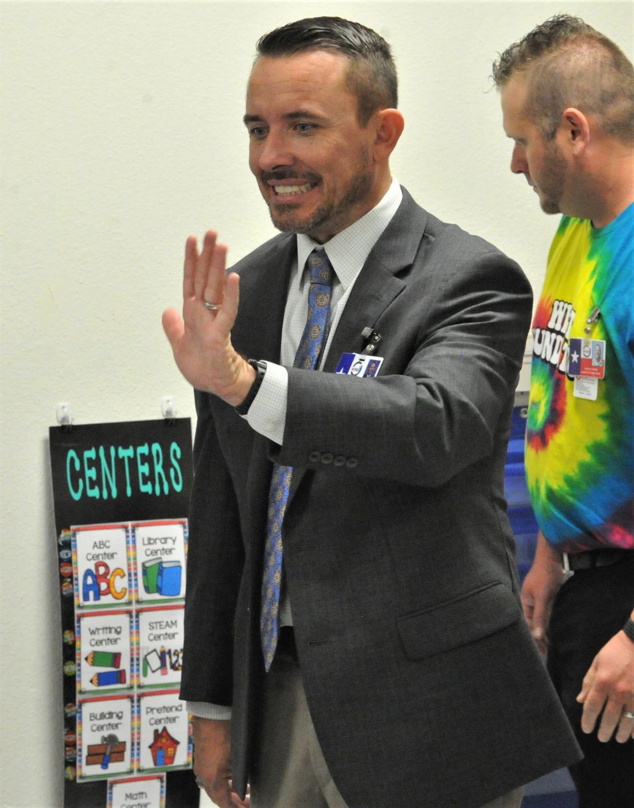 WFISD Superintendent Donny Lee smiles and waves to students at West Foundation Elementary School on the first day of school for WFISD students on Wednesday, August 17, 2022.