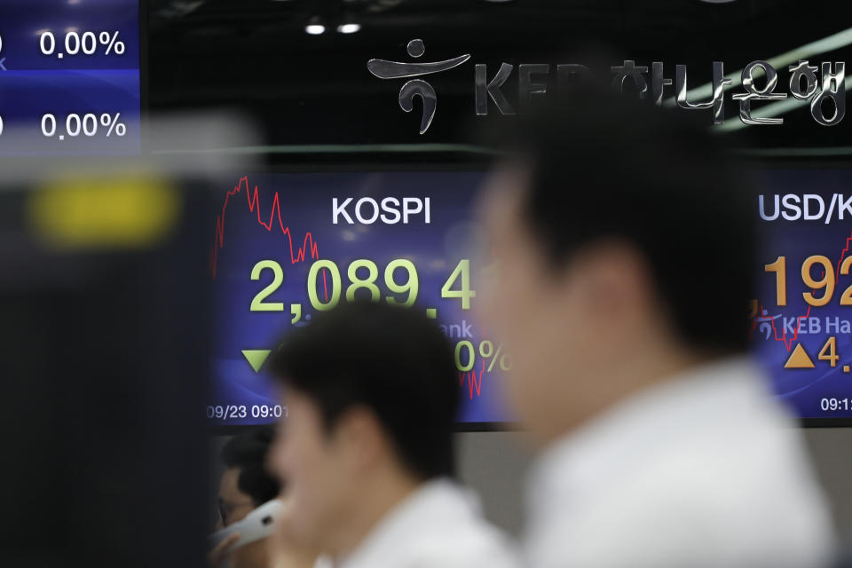 Currency trader watch their computer monitors near screens showing the Korea Composite Stock Price Index (KOSPI) at the foreign exchange dealing room in Seoul, South Korea, Monday, Sept. 23, 2019. Stocks got a downbeat start to the week as investors kept a wary eye on tensions with Iran and on signals from China and the U.S. on prospects for a resolution of their tariffs war. (AP Photo/Lee Jin-man)