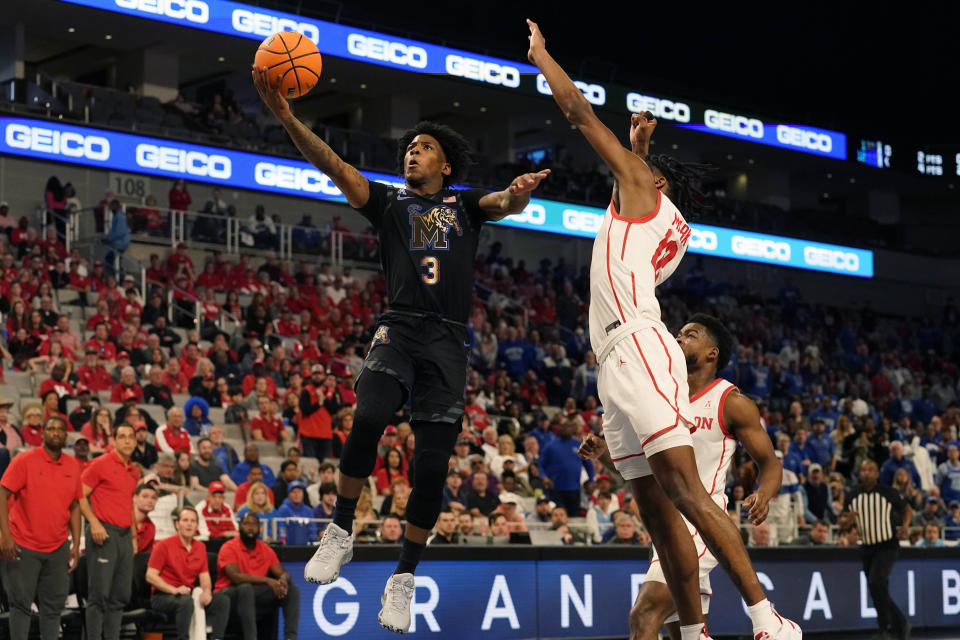 Memphis guard Kendric Davis (3) drives to the basket against Houston guard Tramon Mark during the first half in the finals of the American Athletic Conference Tournament, Sunday, March 12, 2023, in Fort Worth, Texas. (AP Photo/LM Otero)