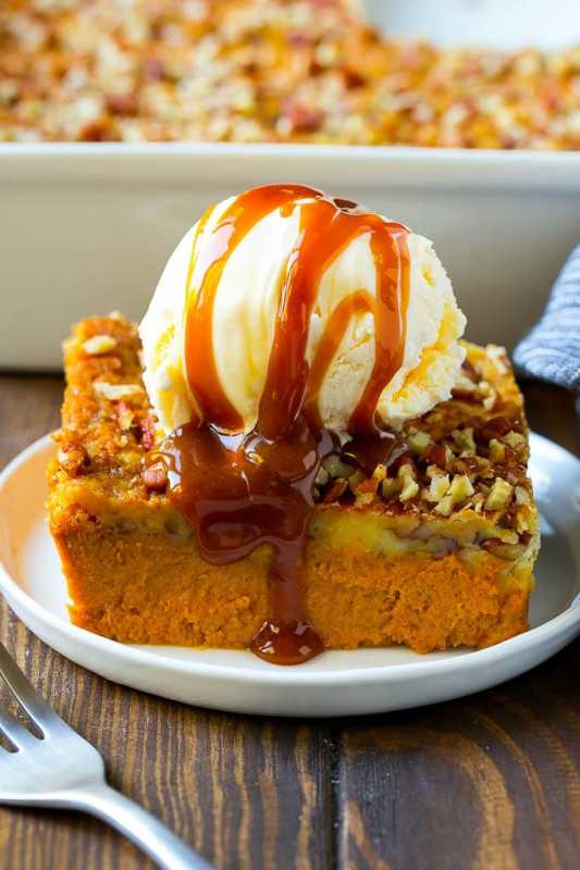 <p>Dinner at the Zoo</p><p>This pumpkin dump cake is a creamy pumpkin pie filling topped with a decadent pecan butter cake. Serve with ice cream on top for the perfect end to any fall dinner or holiday meal. </p><p><strong>Get the recipe: <em><a href="https://www.dinneratthezoo.com/pumpkin-dump-cake/" rel="nofollow noopener" target="_blank" data-ylk="slk:Pumpkin Dump Cake;elm:context_link;itc:0;sec:content-canvas" class="link ">Pumpkin Dump Cake</a></em></strong></p>
