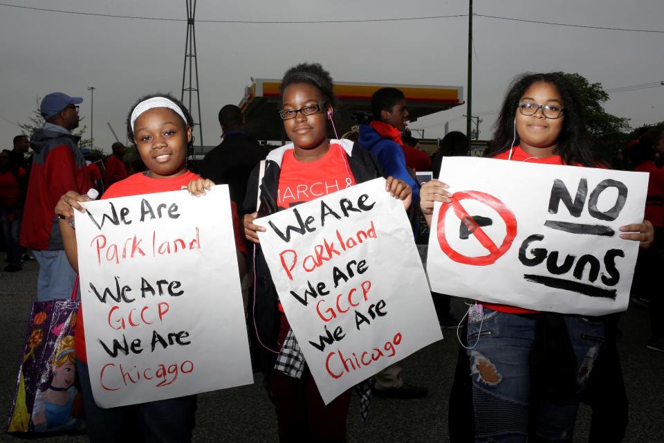 Tomaya Gayton, Jada Posey and Nanyamka Lopez, all freshman at Gary Comer College Prep school pose for a portrait after Pastor John Hannah of New Life Covenant Church lead a march and pray for our lives against gun violence in Chicago, Illinois, U.S., May 19, 2018.