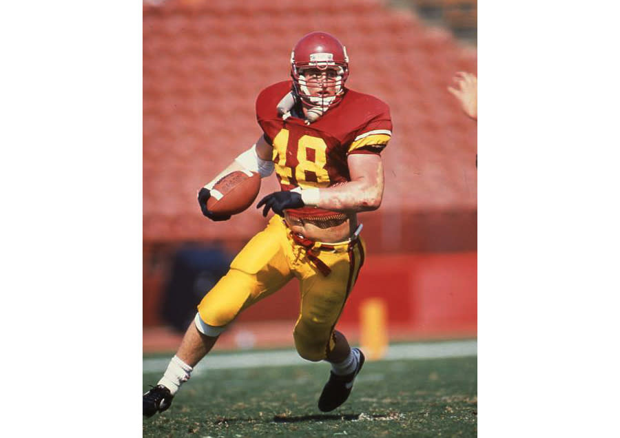 In a photo provided by USC Athletics, former Southern California player Matthew Gee plays in an NCAA college football game. A lawsuit alleging that the NCAA failed to protect a former Gee from repeated concussions is nearing trial in a Los Angeles court, with a jury seated Thursday, Oct. 20, 2022, in what could become a landmark case. The suit filed by Gee's widow says the former USC linebacker died in 2018 from permanent brain damage caused by countless blows to the head he took while playing for the 1990 Rose Bowl-winning team. (USC Athletics via AP)
