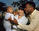 FILE - Brazilian soccer star Pele and his wife Rosemeri pose for a photo with their daughter Kelly, in an unknown location, June 1967. Pelé, the Brazilian king of soccer who won a record three World Cups and became one of the most commanding sports figures of the last century, died in Sao Paulo on Thursday, Dec. 29, 2022. He was 82. (AP Photo, File)