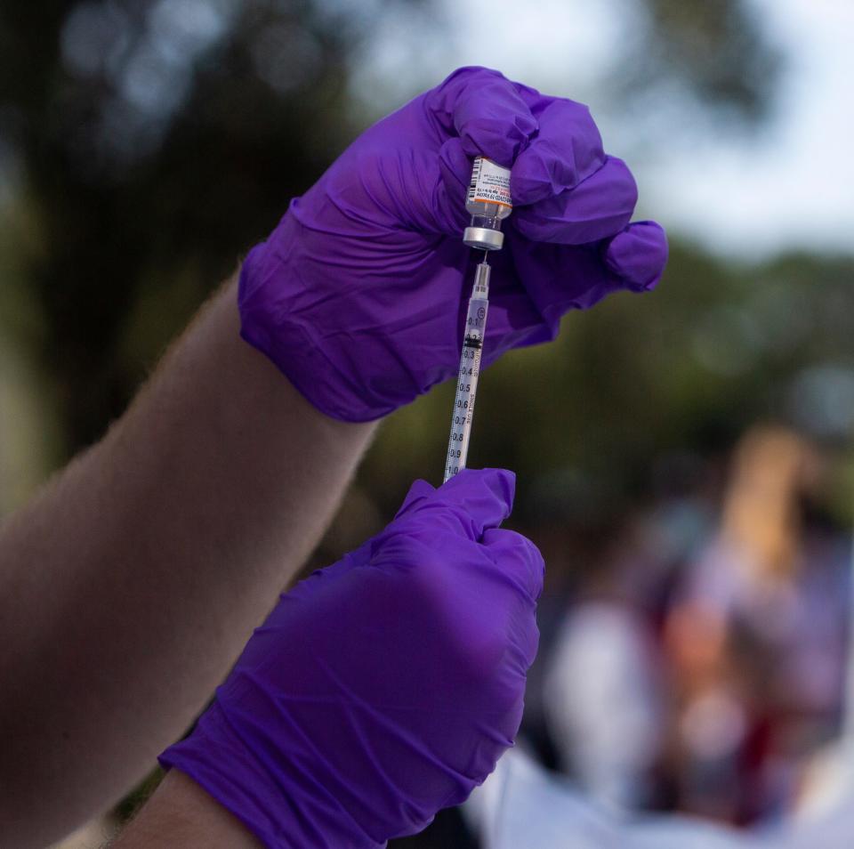 A Pfizer COVID-19 vaccine is prepared at a vaccination clinic outside of Lee Health's Golisano Children's Hospital of Southwest Florida at HealthPark in Fort Myers