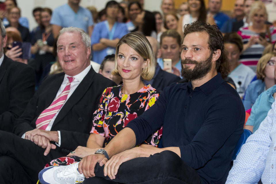 Northern Irish actor Jamie Dornan (right) with his sister Jessica Dornan Lynas and father Dr Jim Dornan, during the Pancreatic Cancer charity NIPanC launch at the Mater Hospital in Belfast. (Photo by Liam McBurney/PA Images via Getty Images)