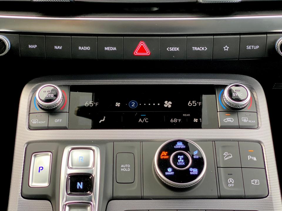 The touch-sensitive climate control screen on the center console of a Hyundai Palisade SUV.