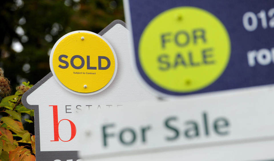 File photo dated 14/10/14 of Sold and For Sale signs. House prices have seen "next to no movement" over the past year, standing at just 0.8% higher annually in January, according to an index.