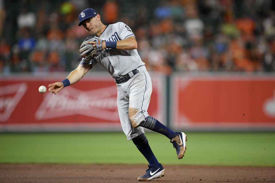 San Diego Padres second baseman Ian Kinsler (3) throws to first during a baseball game against the Baltimore Orioles, Tuesday, June 25, 2019, in Baltimore. The Padres won 8-3. (AP Photo/Nick Wass)