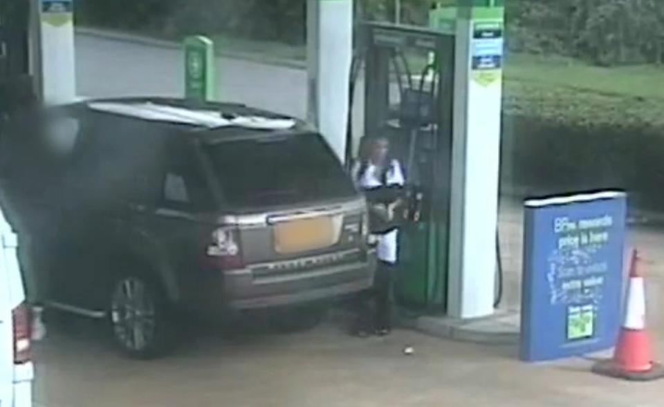 Handout still taken from CCTV issued by Northamptonshire Police of Reality TV star Katie Price at a petrol station after stepping out of the driver's side of her bronze-coloured Range Rover (Northamptonshire Police/PA Wire)