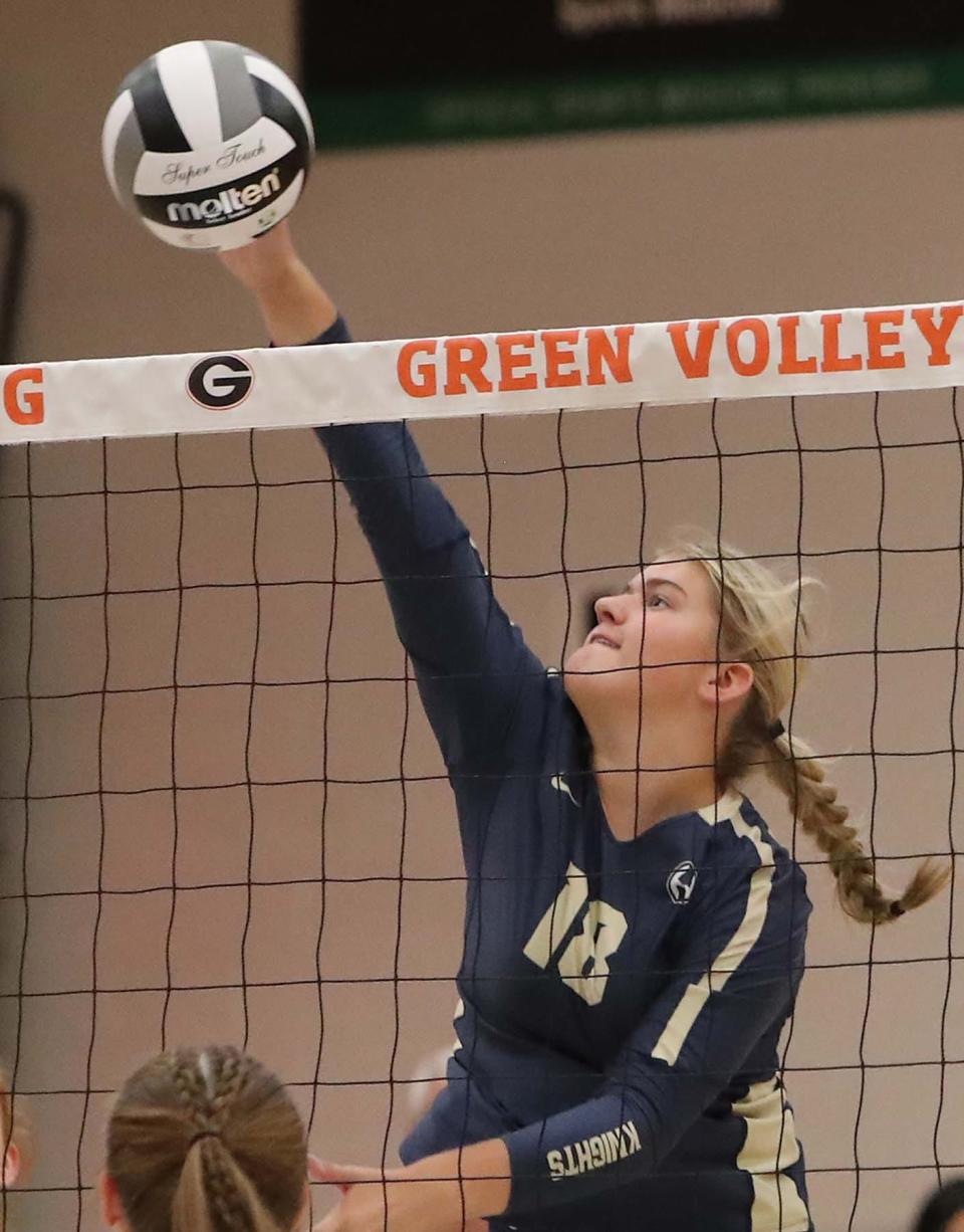 Kathleen Jones of Hoban slams the ball over for a point during the first set of their match against Green at Green High School Wednesday night. Hoban  won 3 sets to 0. 