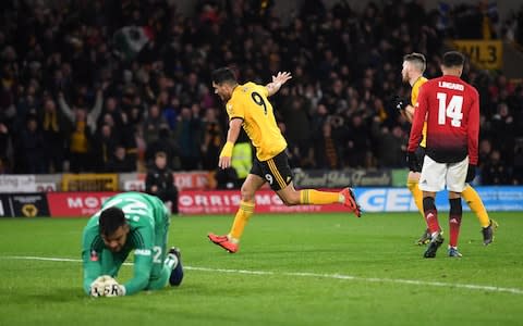 Raul Jimenez of Wolverhampton Wanderers scores his team's first goal during the FA Cup Quarter Final match between Wolverhampton Wanderers and Manchester United - Credit: getty images