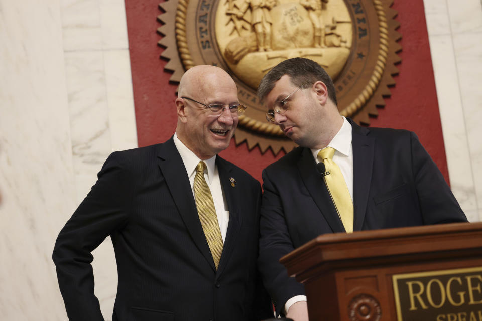 West Virginia Senate President Craig Blair, left, and Speaker of the House Roger Hanshaw speak prior to Gov. Jim Justice's State of the State address in Charleston, W.Va., on Wednesday, Jan. 10, 2024. (AP Photo/Chris Jackson)