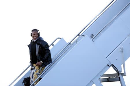 Jan 31, 2016; San Jose, CA, USA; Carolina Panthers quarterback Cam Newton exits a plane during team arrivals at the Mineta San Jose International Airport in preparation of Super Bowl 50 against the Denver Broncos. Mandatory Credit: Cary Edmondson-USA TODAY Sports