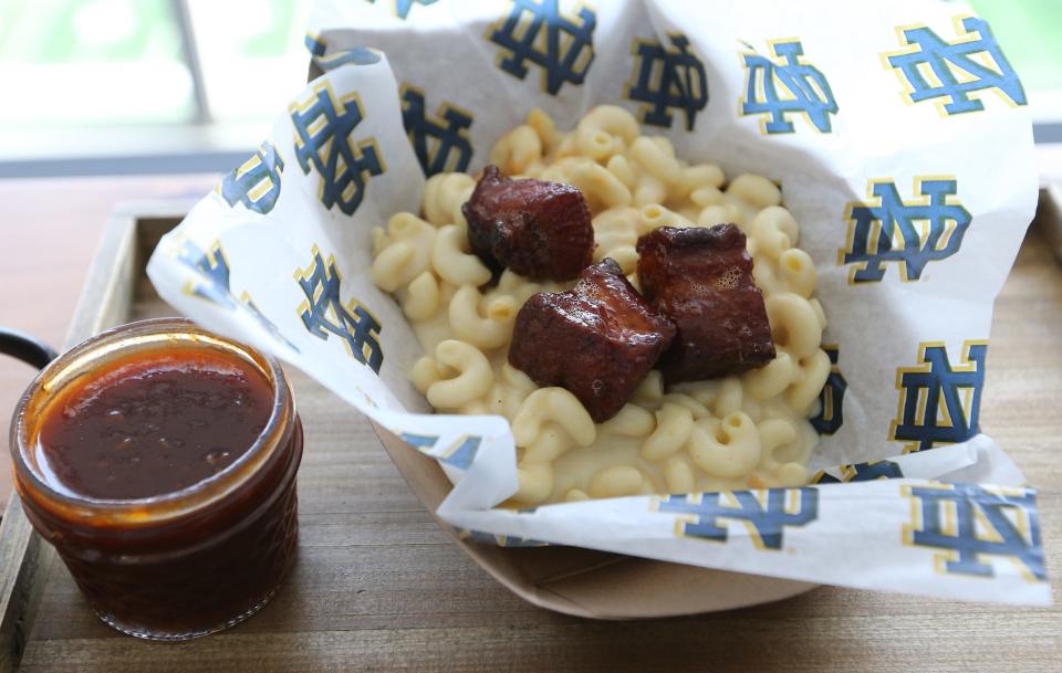 New for this season, a three-cheese mac and cheese dish will be topped with seared pork belly tossed in gochujang barbecue sauce for Notre Dame football fans. This and other ew food items will join some all-time favorites for fans this year at Notre Dame Stadium.