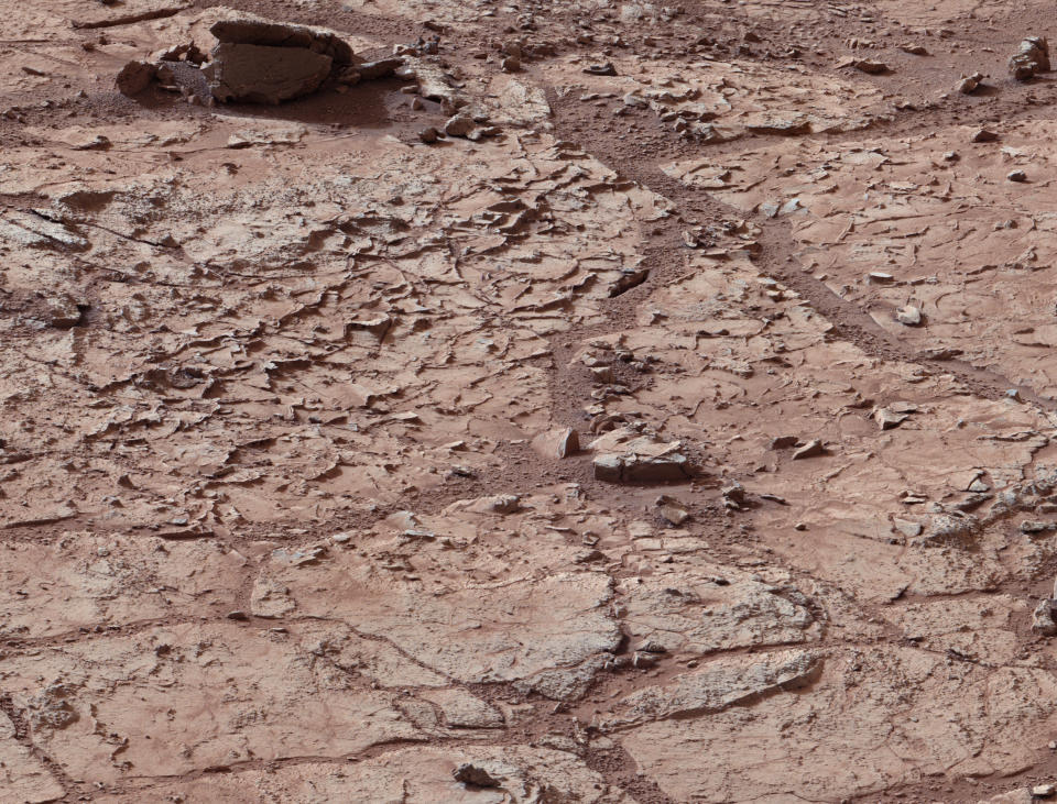 <p>The surface of the planet Mars inside Gale’s Crater is shown as NASA’s Mars rover Curiosity drives toward a flat rock with pale veins that may hold clues to a wet history on the planet in this NASA handout photo released January 15, 2013. (Photo: NASA/Reuters) </p>